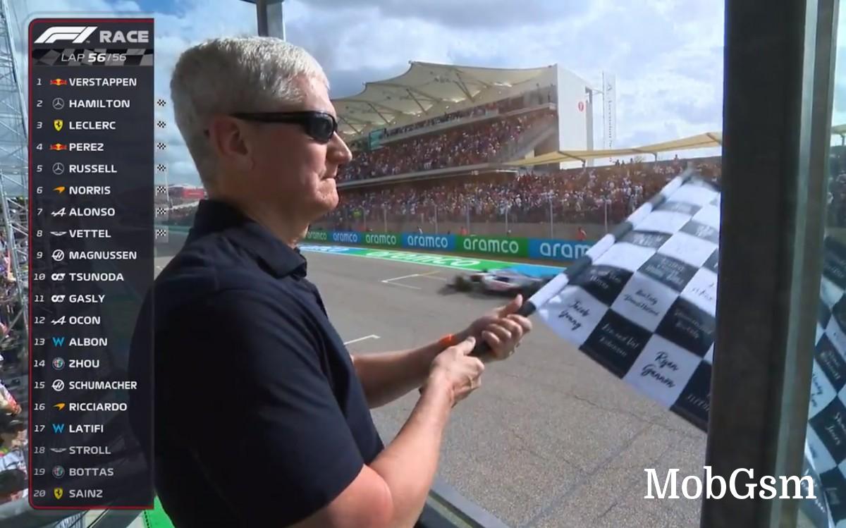 Tim Cook waving the checkered flag at the US Grand Prix in Austin, Texas 2022